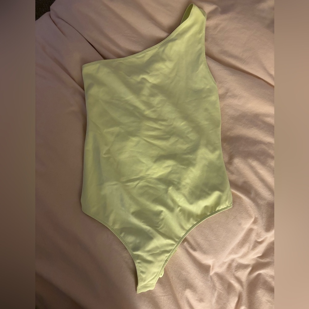 Free people movement one shoulder body suit with open back bow design !